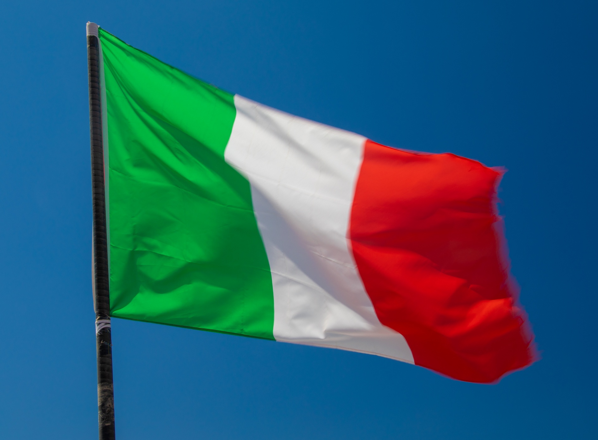 Flag of Italy against blue sky